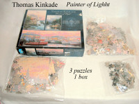 3 Jigsaw Puzzles, boxed , 24x18”, 34x12”, 9x7" Kinkaid paintings