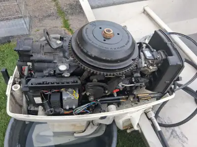 2001 Johnson 50 hp. 2 stroke long shaft, remote, new lower unit, new impeller, new prop, and a new s...