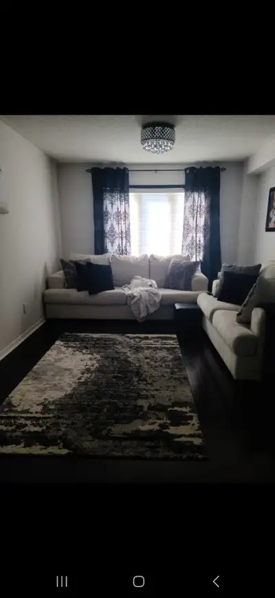Moving and need to sell 1yr old Ashley Furniture 4 seater and w seater sofas with throw pillows. Rea...
