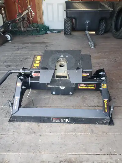 Demco 21K 5th wheel hitch - and 25K ball hitch. Complete with slide rails, like new. 5th wheel was u...
