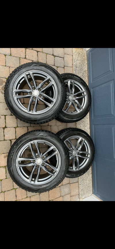 Four Nexen “Windguard” Winter tires on Alloy rims,size 215/60R17.Wheels have a 5x112 bolt pattern th...