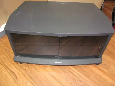 T.V. Stand with a double shelf underneath 33 1/2" wide X 19" Long X 15 1/2" high with 2 glass doors...