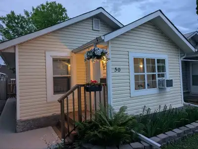 Located in St Vital convenient central location, easy access to everything 2 bedroom plus den, fence...