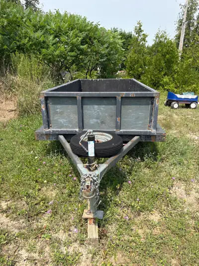 8x4 ft trailer. Steel frame with wood walls and floor. Has spare tire. Located just outside Eganvill...