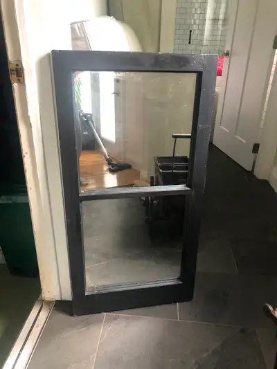 This vintage black wood framed window mirror is a charming, pre-owned piece that adds a touch of rus...