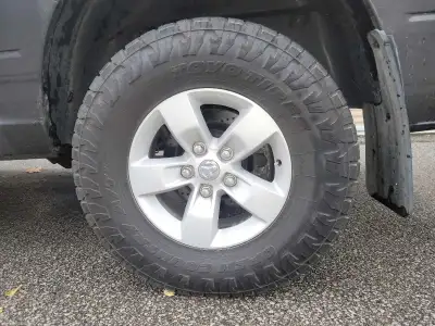 Toyo open country at3 all terrain tires on ram 1500 five bolt 17 inch rims in A+ condition. Fits 200...