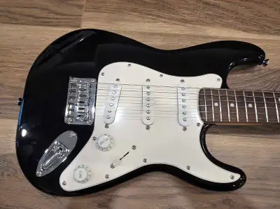 Guitar only No gigbag Will include some picks (not a full-size guitar) Squier by Fender Mini Stratoc...