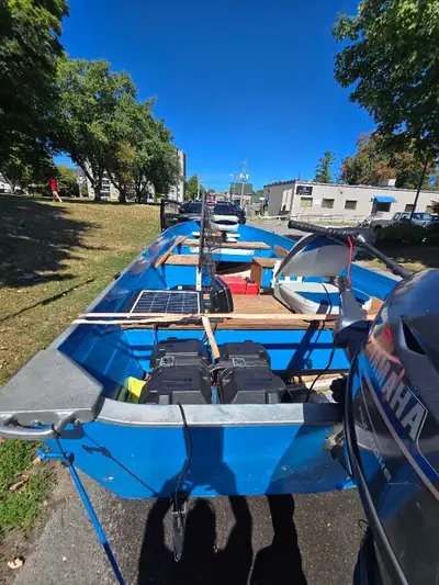 16.5 foot Boat motor trailer very deep and wide new transom last year new tires rims both hub assemb...