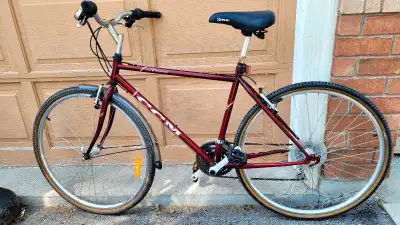 Bike has a lightweight frame and is in good working condition. The rear wheel has minor play—hub con...