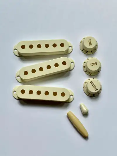 Fender Stratocaster plastic parts set. Cream., View more