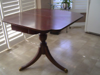 Solid wood pedestal game table with storage