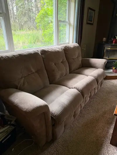 This set includes a comfortable Lazy Boy couch and matching loveseat, both featuring reclining funct...