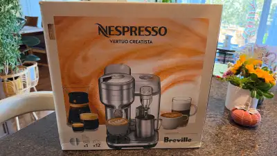 Elevate your morning routine with this Nespresso Vertuo Creatista by Breville, a premium coffee mach...
