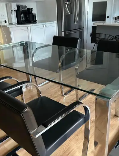 Selling these Eternity Modern dining room chairs. The chairs are top grain black leather designer ch...