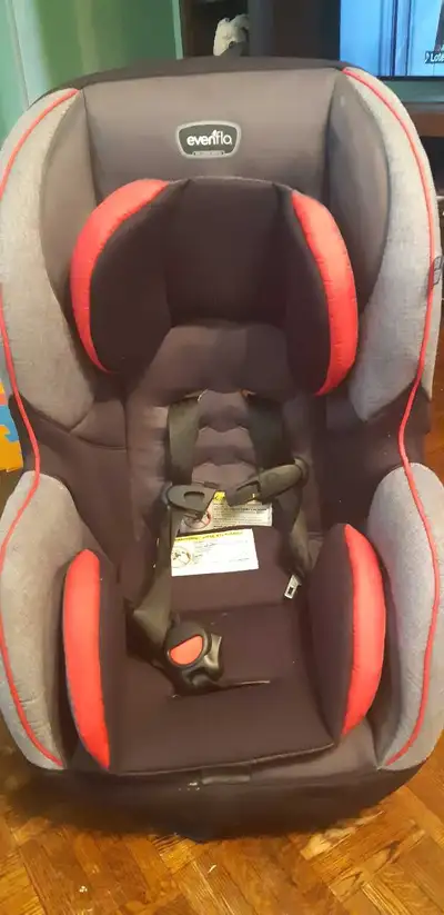 This is an Evenflo car seat designed to grow with your child, featuring adjustable headrest and harn...