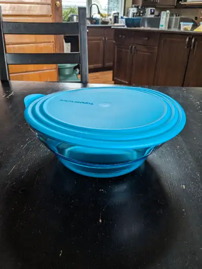 I have a Tupperware Elegant Bowl with lid for sale in Southwest Edmonton — near Southgate Mall. Bran...