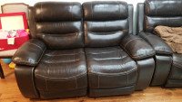 Power reclining brown leather love seat.