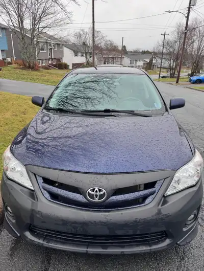 Mint condition Toyota Corolla Sport Edition. 389k kilometers. Comes with 4 moderate wear all season...