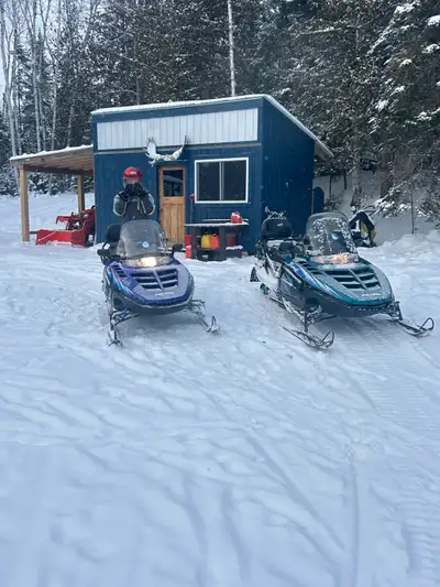 1997 Polaris Indy trails one runs good. The other needs a new top end electric start reverse 1800 or...