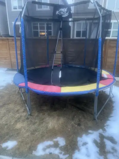 10 Foot Round Trampoline in NW Calgary. Net enclosure, good safety pad. Free OBO.