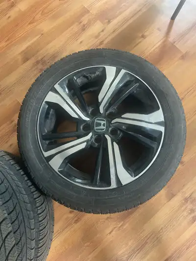 Original Honda rims with winter tires in perfect condition.