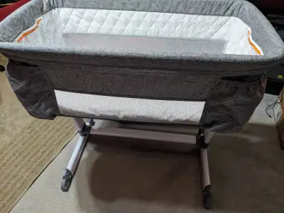 Delta Children Deluxe Bassinet + Mattress Cover Bought it incase the little guy wouldn't go into the...