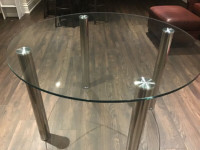 Dining table Glass with chrome legs 45” in diameter