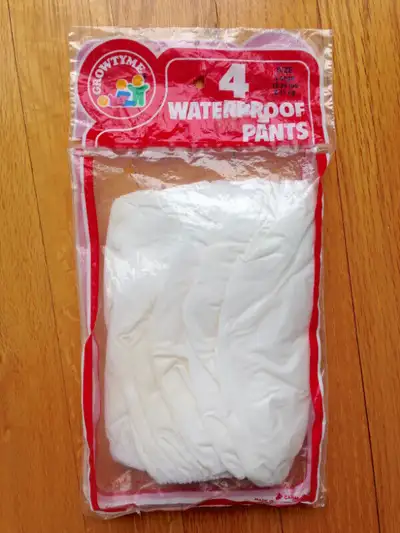 Brand new, sealed package. 4 pairs. Pull-on waterproof baby underpants or diaper covers. Size Large...