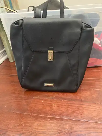 This Tahari black backpack is perfect for everyday use, featuring a stylish design and comfortable s...