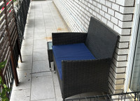 Outdoor bench with cushion and table