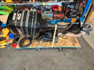 1993 Mercury 40 hp outboard 2 stroke. Includes controls with cables, electrical cables, disassembled...
