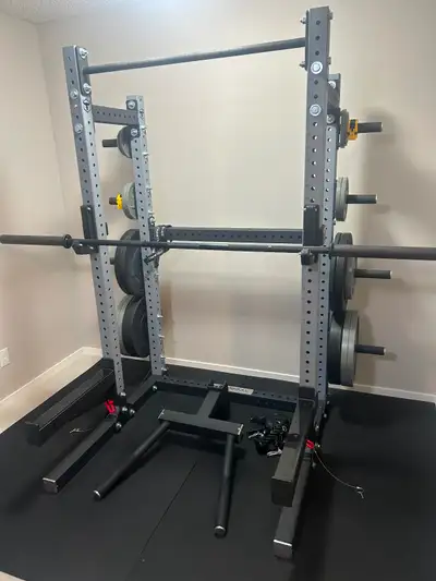 Iron bull squat rack with weight storage, a dip attachment, and a pull up bar The rack is in really...