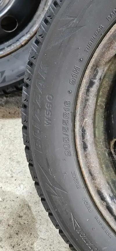 Bridgestone Blizzaks WS90, used 2 winter seasons, VW steel rims, four hub caps off Jetta