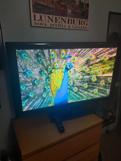LG 47" LCD HD TV with original remote....used but still has a beautiful picture with deep color. The...