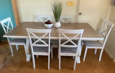 This solid wood farmhouse style harvest table 7 piece dining set features an oak tabletop stained in...