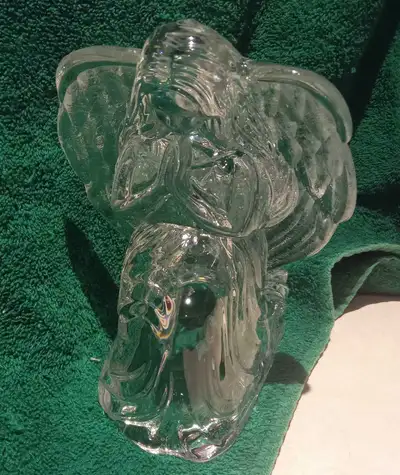 This beautiful, pre-owned clear glass angel figurine features an elegant praying pose and serves as...