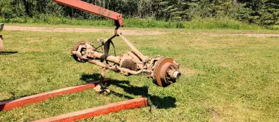 Front axle is dana 50. 3.73 ratio. It needs 1 outer stub shaft and possibly pilot bearing. Actuators...