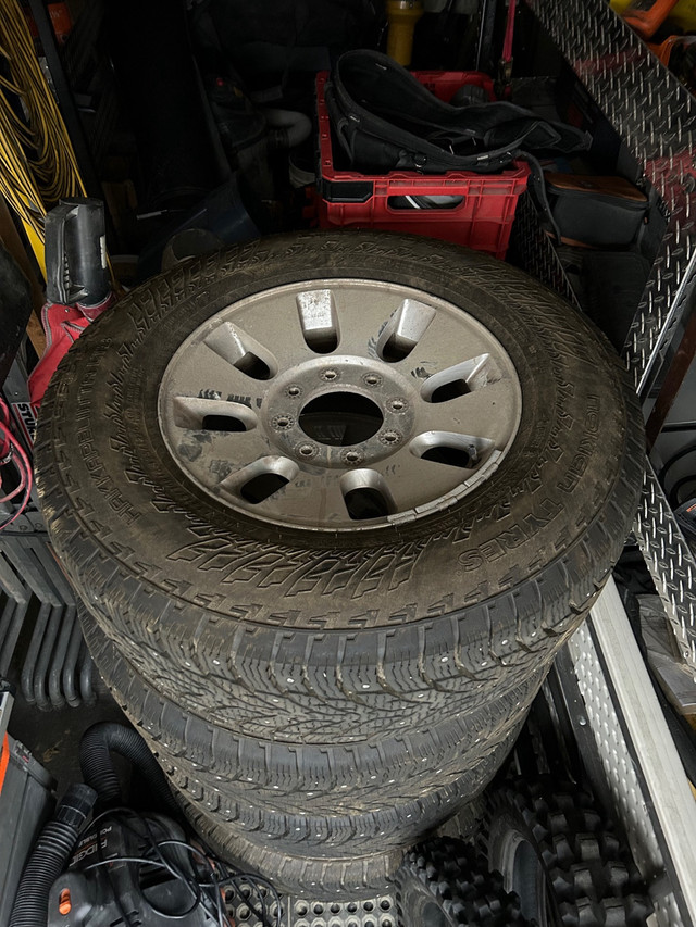 Ford F-350 studded winter tires with factory rims in Tires & Rims in Lethbridge