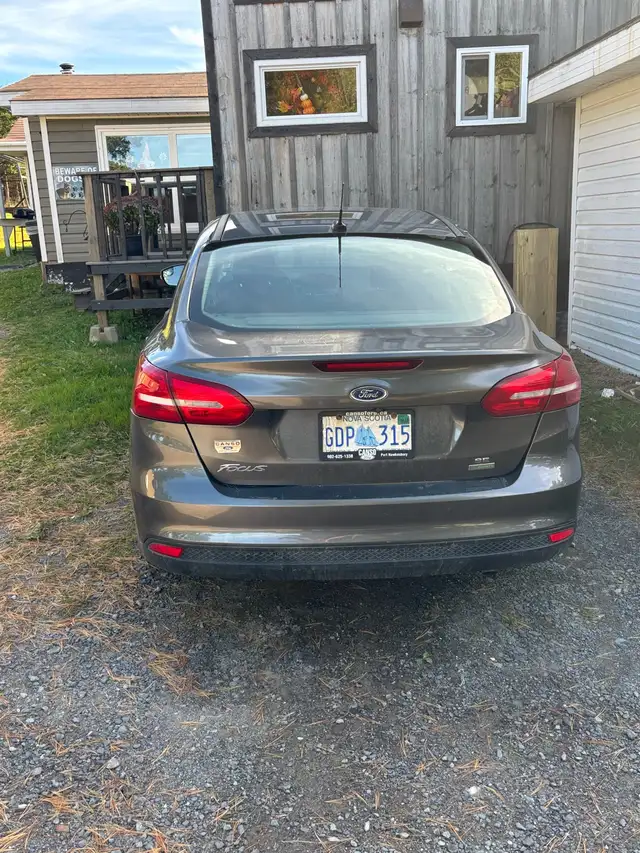 Ford Focus it has 4 studded winter tires on rims goes with it in Cars & Trucks in Cape Breton - Image 5