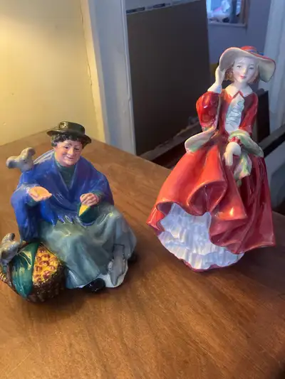 Offered are two charming Royal Doulton figurines: "Tuppence a Bag," HN 2320, designed by Harry Sales...