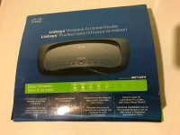 Linksys WRT120N Wireless-N Home Router with power cord.