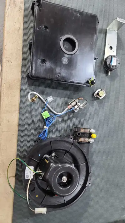 Gas furnace inducer motor,transition plate,high limit switch and igniter unit from a Heil furnace bu...