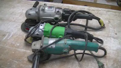 One very large and heavy(14lbs) Black and Decker Industrial angle grinder. Fits 7 inch and 9 inch di...