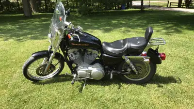 2005 Harley-Davison 883 Sportster. Stored indoors with full windshield, double seat, backrest, two s...