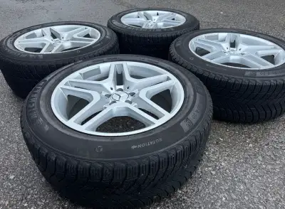 For sale is a set of four Michelin X-Ice Snow SUV Winter Tires mounted on silver Replica MB wheels w...