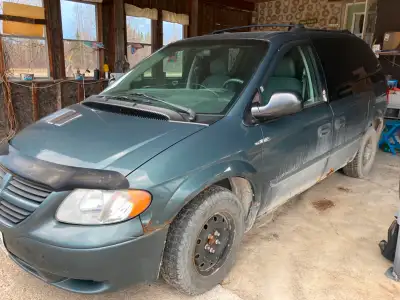 2006 Dodge Grand Caravan, running condition, needs windshield replaced, brake job, and body work. Ha...