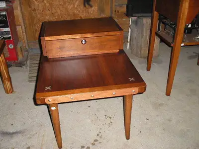 Refinished pc.(Like new) Mahogany trim with flower metal tacking. Early American finish. Single draw...