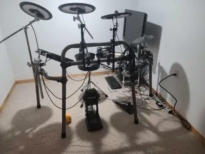 Td15 roland e drums with Xtra cymbal and xtra tom and stool. Tv monitor and computer ( has addictive...