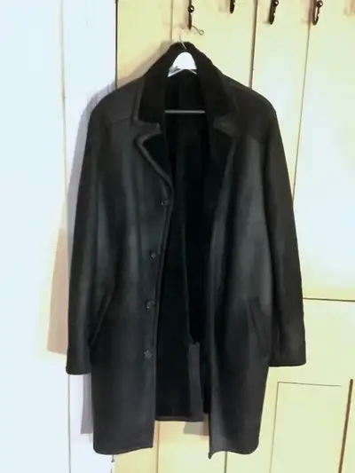 Sheepskin (Shearling) coat in perfect condition. Size Large (42-44" I would guess). Black inside and...