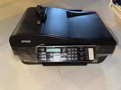Epson Printer, able to print, scan and fax. Only use less than 5 times.
